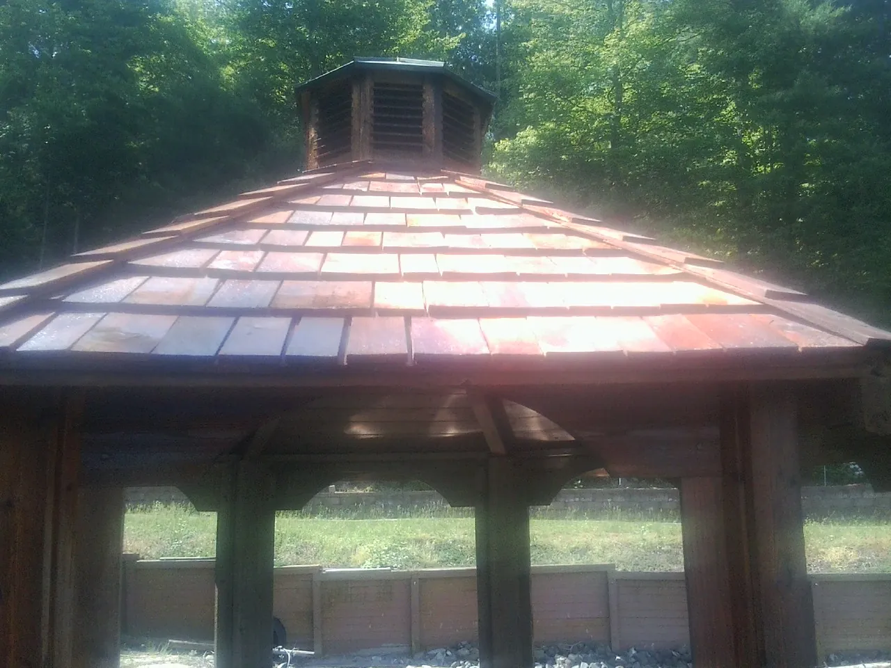 New cedar shake roof and cupola on a lakeside gazebo in West Barnstable